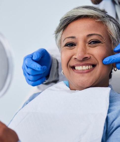 Patient in Lakewood smiling after affordable teeth whitening treatment 