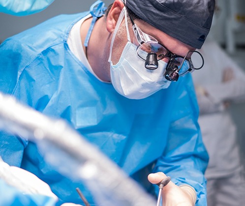 Dentist performing surgery