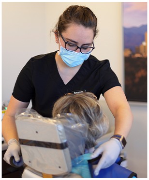 Lakewood dental team member treating dental patient