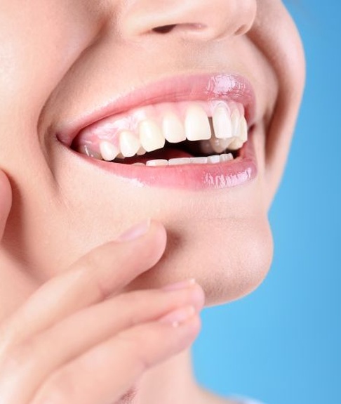 Woman’s smile with gap between front teeth