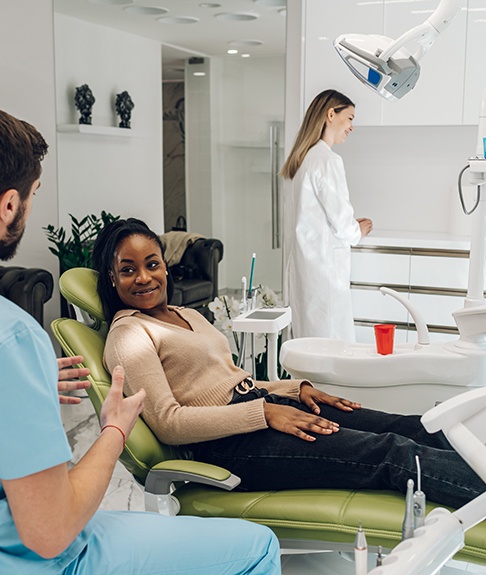 Patient in Lakewood talking to dentist about dental emergencies