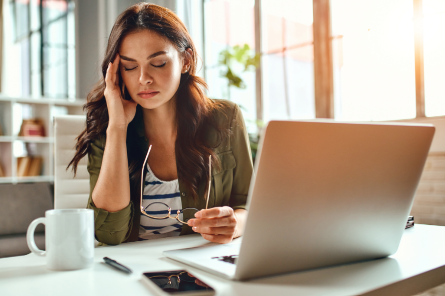 Stressed woman working at desk