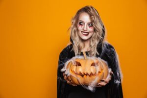 Woman holding a jack-o'-lantern
